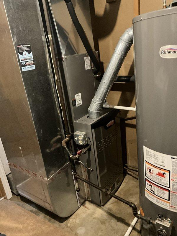 Completed comprehensive furnace tune-up on 11-year-old heating system. Performed full system inspection, replaced 16x20x1 air filter which showed significant dust accumulation, verified all mechanical and electrical connections, and confirmed proper operation of furnace and associated HVAC equipment in basement utility area.