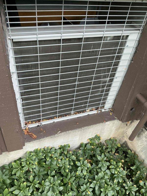 Completed comprehensive BFMA preventive maintenance tune-up on air handler system serving residential property. Equipment is approximately 4+ years old and includes both indoor air handler components and outdoor condenser unit. Performed complete system inspection, noting visible rust and corrosion present along bottom edge of condenser unit frame where metal meets concrete pad, requiring monitoring for future deterioration. Cleaned condenser coils, checked refrigerant levels, inspected electrical connections, tested thermostat operation, and verified proper airflow throughout system. All components functioning within normal operating parameters upon completion of service.