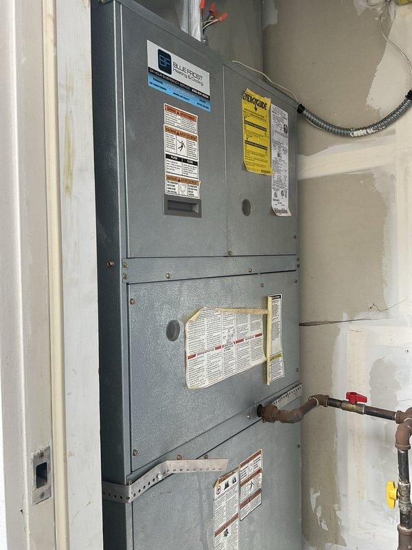 Completed comprehensive air conditioning tune-up on 10-year-old vertical air handler unit. Performed full system inspection including blower motor assembly, electrical connections, refrigerant lines, and all safety controls. All components found operating within normal parameters; system tested and confirmed ready for cooling season.