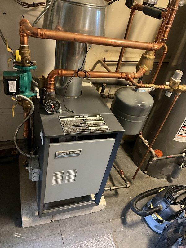 Completed comprehensive boiler tune-up service on Weil-McLain residential heating system as part of BFMA maintenance agreement. Performed full system inspection including control panel diagnostics, verified operational temperature at 180°F on digital display, tested all safety lockout controls and indicator lights, inspected circulator pump and pressure gauges for proper operation, examined copper piping network and brass fittings for leaks or corrosion, and verified proper function of expansion tanks and zone valves. All components found operating within manufacturer specifications and system left in optimal working condition.