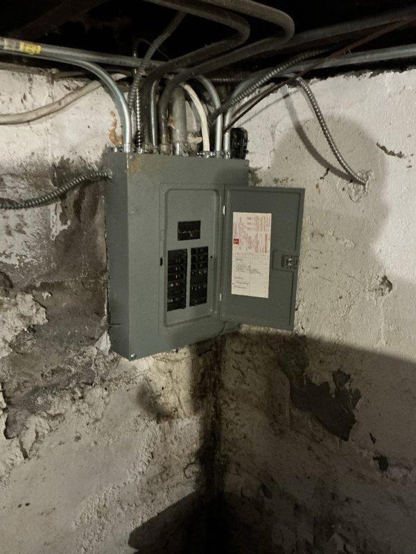 Completed full system estimate for residential HVAC replacement following diagnosis of failed heat exchanger causing no heat condition. Evaluated existing furnace, ductwork with reinforced trunk line, humidifier integration, refrigerant lines, and electrical service panel to determine proper equipment sizing and replacement scope. Documented current system configuration including galvanized ductwork, white bypass humidifier unit with PVC connections, and copper refrigerant line routing to provide comprehensive replacement options for both complete system upgrade and furnace-only replacement scenarios.