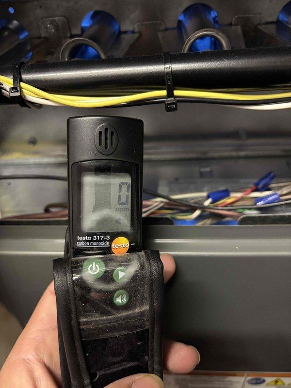 Completed comprehensive BFMA tune-up service including furnace maintenance and humidifier inspection. Performed combustion analysis with Testo 317-3 CO detector confirming safe operation with zero carbon monoxide detected at gas manifold. Noted rust-colored staining and water damage on top of furnace casing indicating potential condensation or water intrusion issues that should be monitored. Inspected all electrical connections, wiring harnesses, and internal components with furnace panel opened for full access. Verified proper operation of all mechanical systems, PVC venting configuration, and safety controls. Unit currently operating within normal parameters with humidifier found in no-trouble-found condition.