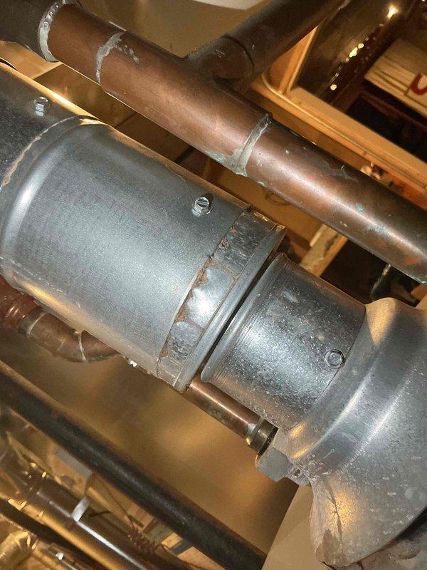 Completed comprehensive BFMA tune-up service on two furnaces, both over four years old, during morning appointment as requested. Performed full system inspection including burner assembly cleaning, heat exchanger examination, blower motor lubrication, air filter replacement, and combustion analysis on both units. Inspected circulator pump motor and associated copper piping, noting surface oxidation on supply lines that does not currently affect system performance. All safety controls tested and verified operational, gas connections checked for leaks, and both furnaces confirmed firing properly with adequate airflow and proper temperature rise across heat exchangers.