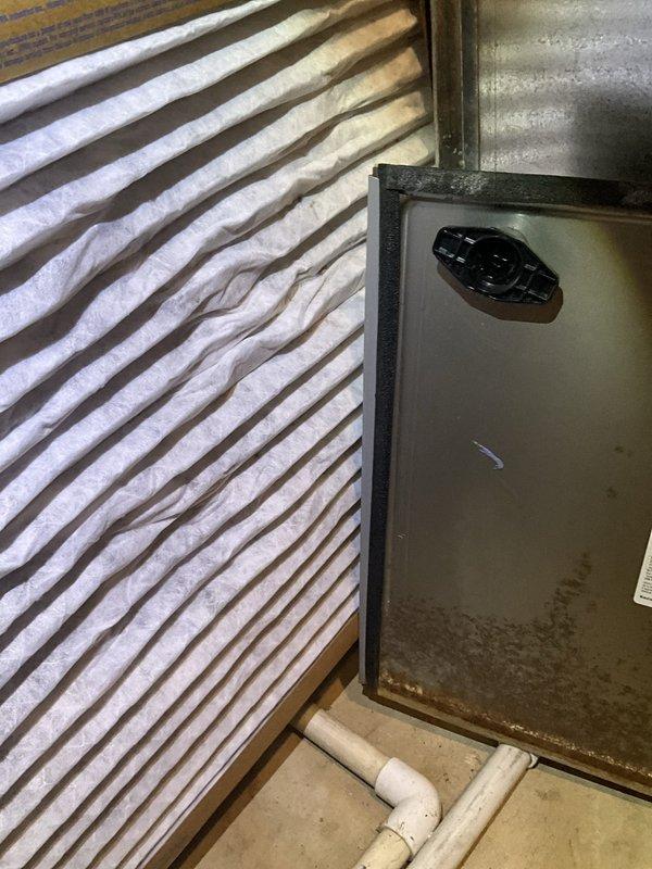 Completed comprehensive furnace tune-up and maintenance inspection on 6-year-old residential HVAC system. Performed full combustion analysis, cleaned burner assembly, inspected heat exchanger for cracks, verified proper gas pressure and ignition sequence, tested safety controls including limit switches and flame sensor, checked blower motor operation and amp draw, inspected and documented condition of pleated air filter in wooden frame housing, examined condensate drain lines and PVC venting system for proper operation, and verified all electrical connections. System operating within manufacturer specifications with no immediate repairs required at time of service.