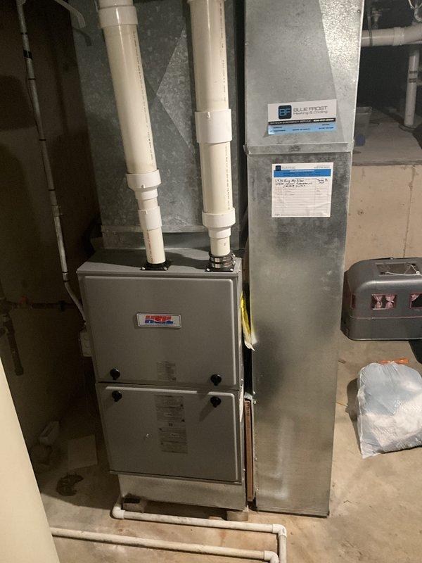 Completed comprehensive furnace tune-up and maintenance inspection on 6-year-old residential HVAC system. Performed full combustion analysis, cleaned burner assembly, inspected heat exchanger for cracks, verified proper gas pressure and ignition sequence, tested safety controls including limit switches and flame sensor, checked blower motor operation and amp draw, inspected and documented condition of pleated air filter in wooden frame housing, examined condensate drain lines and PVC venting system for proper operation, and verified all electrical connections. System operating within manufacturer specifications with no immediate repairs required at time of service.