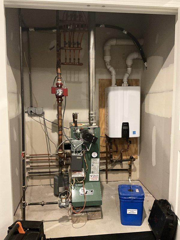 Completed comprehensive BFMA tune-up service on residential HVAC system including three furnaces, three humidifiers, one tankless water heater, and one boiler unit, all approximately 12 years old. Performed complete inspection, cleaning, and operational testing of all equipment per maintenance protocol. Verified proper combustion efficiency on furnaces and boiler, inspected heat exchangers for cracks or deterioration, tested all safety controls and limit switches, and confirmed proper venting and flue draft. Serviced tankless water heater including descaling procedure, inlet filter cleaning, burner inspection, and flow sensor verification. Evaluated boiler system including pressure testing, circulator pump operation, expansion tank pre-charge verification, and zone valve functionality. Inspected all three humidifier units, cleaned water panels, verified water flow and drainage, tested humidistats, and confirmed proper operation. Checked all copper piping, brass fittings, and valve asse