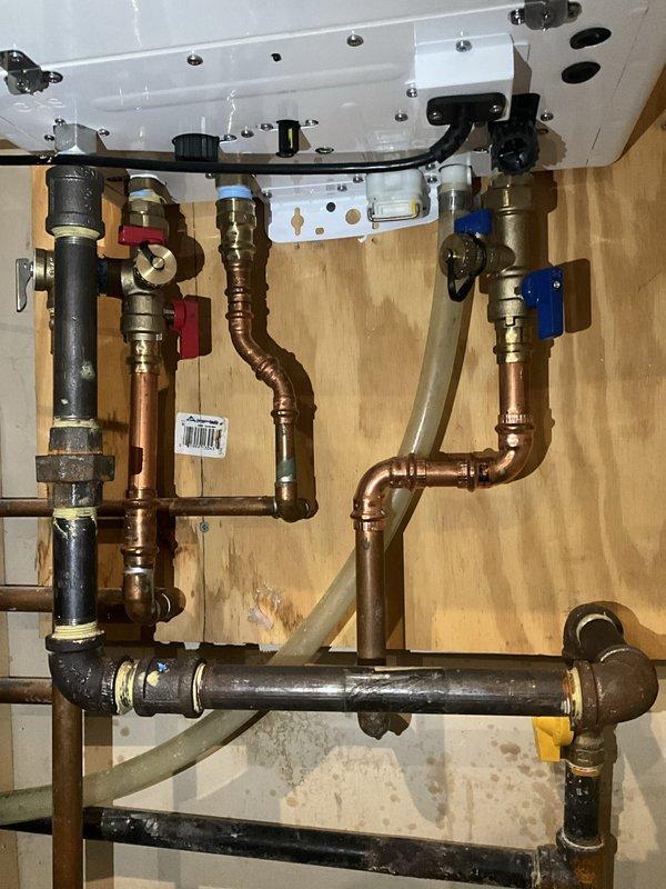 Completed comprehensive BFMA tune-up service on residential HVAC system including three furnaces, three humidifiers, one tankless water heater, and one boiler unit, all approximately 12 years old. Performed complete inspection, cleaning, and operational testing of all equipment per maintenance protocol. Verified proper combustion efficiency on furnaces and boiler, inspected heat exchangers for cracks or deterioration, tested all safety controls and limit switches, and confirmed proper venting and flue draft. Serviced tankless water heater including descaling procedure, inlet filter cleaning, burner inspection, and flow sensor verification. Evaluated boiler system including pressure testing, circulator pump operation, expansion tank pre-charge verification, and zone valve functionality. Inspected all three humidifier units, cleaned water panels, verified water flow and drainage, tested humidistats, and confirmed proper operation. Checked all copper piping, brass fittings, and valve asse