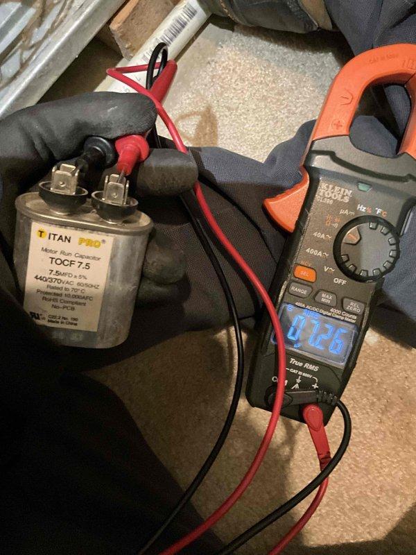 Completed comprehensive BFMA furnace tune-up on 19-year-old heating system located in basement mechanical room. Performed full system inspection, tested and verified capacitor functionality using diagnostic equipment with readings within acceptable parameters at 0.26, cleaned burner assembly, checked all electrical connections, inspected heat exchanger for cracks or deterioration, verified proper gas pressure and combustion, tested safety controls including limit switches and flame sensor, examined ductwork connections for air leaks, and confirmed proper airflow throughout the system. Replaced furnace filter, lubricated blower motor bearings, and verified thermostat operation and calibration. All components operating within manufacturer specifications with no immediate repairs required at this time.