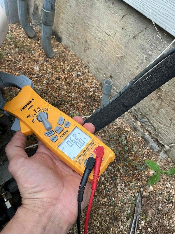 Completed comprehensive BFMA tune-up service on residential split system including one air conditioning unit and one air handler after 4 PM as requested. Performed thorough inspection of evaporator coil assembly within air handler cabinet, noting A-frame heat exchanger configuration with visible copper refrigerant lines and condensate drainage system. Conducted electrical diagnostics on outdoor condensing unit using digital multimeter to verify proper voltage and amperage readings, ensuring system operating within manufacturer specifications. All components inspected, cleaned, and tested for optimal performance as part of recurring maintenance agreement.