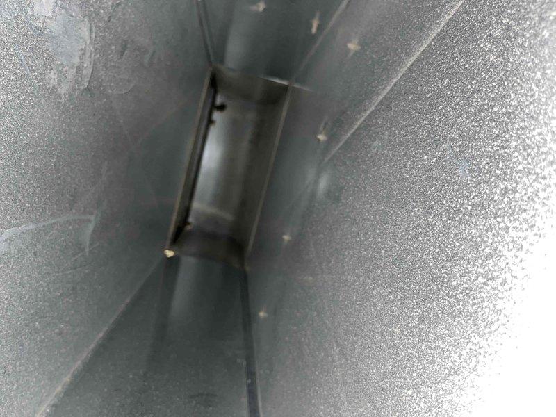 Completed comprehensive duct cleaning service for residential HVAC system. Pre-service inspection revealed significant accumulation of dust, lint, and airborne debris throughout the ductwork, with several millimeters of fibrous particulate matter coating interior surfaces and concentric buildup in circular duct sections. Thoroughly cleaned all accessible ductwork, removed accumulated contaminants from metal plenum sections and ventilation components, and restored proper airflow pathways throughout the system.