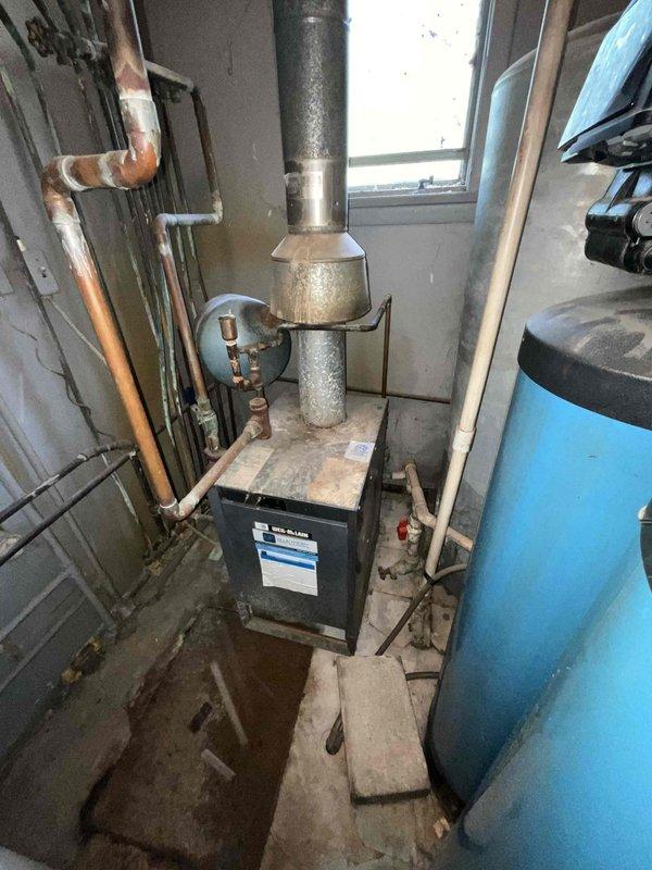 Responded to no-heat call for residential boiler system. Upon arrival, performed comprehensive diagnostic inspection of heating equipment and associated components. Evaluated boiler unit, examined temperature and pressure gauges, inspected copper supply piping showing advanced corrosion and oxidation, and assessed venting system condition. Checked electrical connections, thermostat operation, and fuel supply. No operational faults were identified during testing, and unit functioned properly upon inspection. Documented equipment age and overall condition through photographic records. Given the visible deterioration of piping components and the age of the existing boiler system, provided client with replacement options and recommendations for upgrading to more efficient equipment to prevent future service issues.