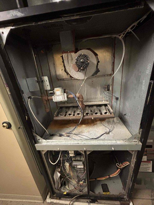 Completed comprehensive BFMA tune-up service on three commercial furnace units at lower level location. Performed full inspection, cleaning, and testing procedures on all units, including one newer unit (approximately 1 year old) and two older units (approximately 24 years old). Inspected burner assemblies, heat exchangers, and combustion chambers; noted accumulated dust and mineral deposits on older equipment. Verified electrical connections and control systems on all units. Measured and recorded amperage draw on blower motors using clamp meter, confirming readings within manufacturer specifications at 46.4 amps. Checked all safety controls, limit switches, and flame sensors for proper operation. Cleaned blower assemblies and replaced air filters where applicable. All three furnace units tested and left in proper working condition with no immediate safety concerns identified.