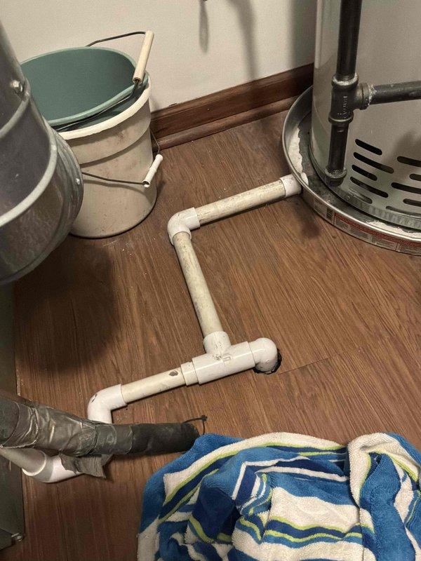 Responded to intermittent water leak in laundry room originating from HVAC unit. Upon inspection, identified condensate drainage issue with PVC piping system connected to condensate pump. Reconfigured and secured condensate drain lines, verified proper pitch and connections to ensure adequate drainage from air handler. Tested system operation and confirmed no active leaking; towels placed on floor to monitor for any residual moisture.
