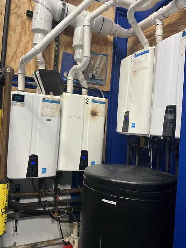 Completed comprehensive BFMA tune-up service on four commercial tankless water heaters with varying equipment ages of 3, 5, and 7 years. Performed standard maintenance protocol including inspection of all units, verification of proper operation, examination of venting systems, assessment of water and gas connections, and testing of digital control panels to ensure optimal performance. All tankless water heaters, expansion tank, and associated PVC piping systems were inspected and found operating within manufacturer specifications.