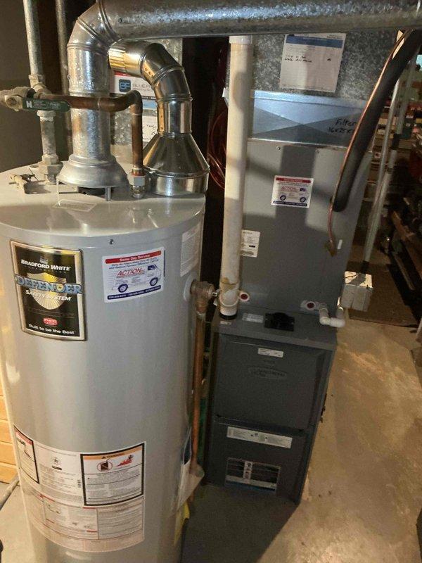 Completed comprehensive BFMA tune-up service on 9+ year old furnace system during afternoon appointment window. Performed full inspection of blower wheel assembly, noting dust accumulation on squirrel cage fan blades and vanes; cleaned and serviced blower compartment to restore optimal airflow efficiency. Inspected furnace unit positioned adjacent to water heater in basement mechanical room, verified all system components, ductwork connections, and operational safety controls functioning properly.