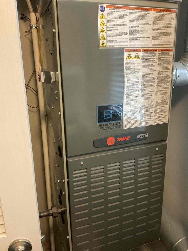 Completed comprehensive furnace and air conditioning tune-up on 4-year-old Trane XV80 system. Performed full inspection of gas valve, burner assembly, and heat exchanger, confirmed proper operation of all burners with characteristic blue flame pattern, verified electrical connections and wire management throughout unit, and documented equipment condition with photographs. All components found to be operating within manufacturer specifications with no deficiencies noted.