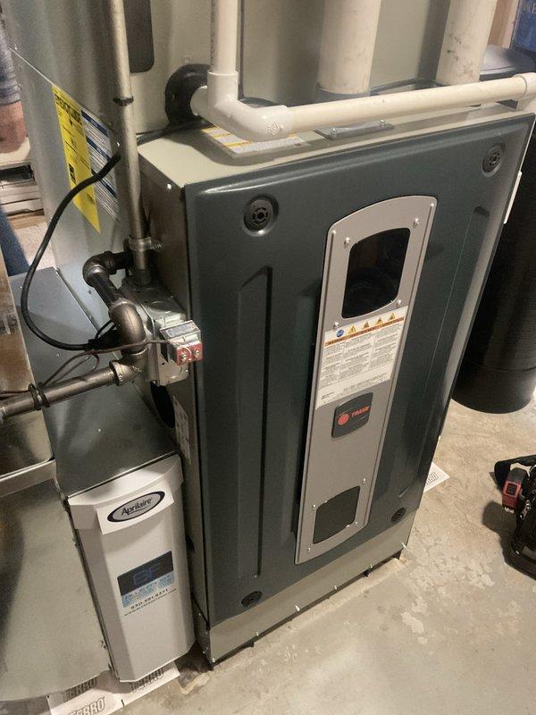 Completed comprehensive BFMA furnace tune-up on Trane air handler system with integrated Aprilaire humidifier. Performed full preventive maintenance inspection including filter check, burner examination, heat exchanger evaluation, blower motor assessment, electrical connections verification, and combustion analysis. All system components tested and operating within manufacturer specifications, with humidifier functioning properly and condensate drainage lines confirmed clear and operational.