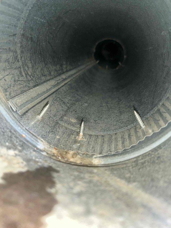 Performed comprehensive duct cleaning service on residential HVAC system. Thoroughly cleaned interior ductwork, removing accumulated dust, lint, and debris buildup from ribbed metal ventilation pipes and blower wheel assembly. System airflow restored to optimal performance with all components left in clean, functional condition.