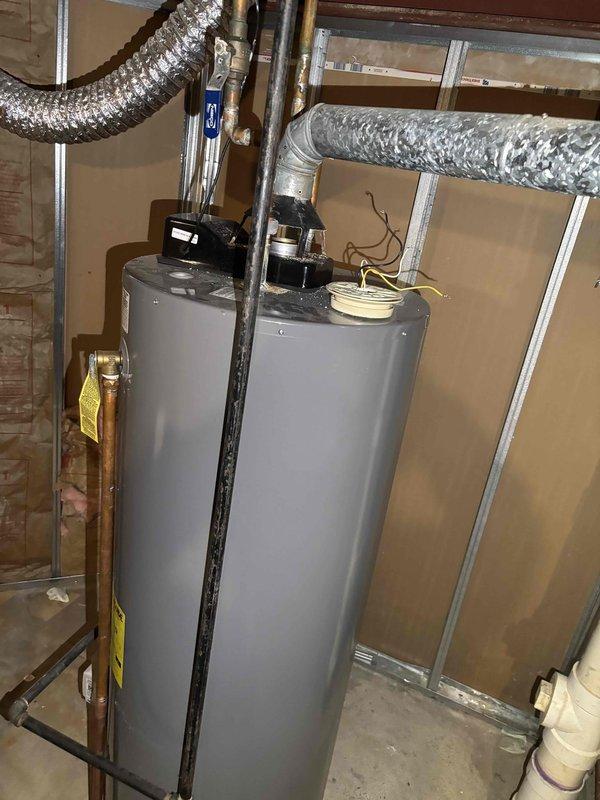 Completed comprehensive BFMA tune-up service on 12-year-old furnace system, including full inspection, cleaning, and performance testing of all components. Identified and documented safety concern with water heater exhaust pipe requiring correction to meet code compliance. Observed significant condensation accumulation on supply ductwork in basement mechanical space, indicating potential insulation deficiency or humidity imbalance that may require future attention to prevent moisture-related issues.