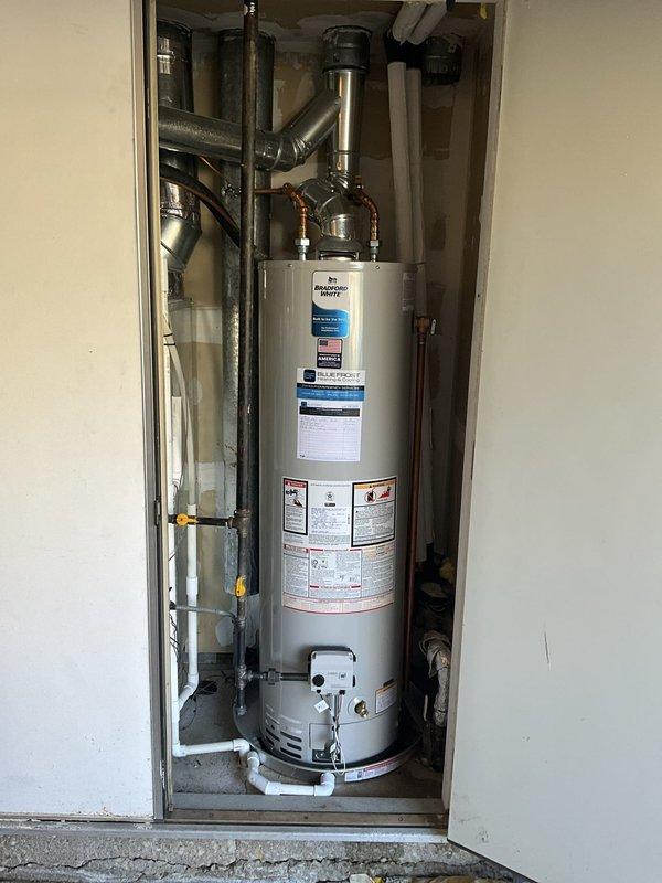 Performed routine maintenance flush on a Bradford White 40-gallon natural gas water heater, model RG140T6N. Drained sediment buildup from tank, flushed system to restore optimal heating efficiency and extend equipment lifespan. Verified all plumbing connections, gas lines, and PVC drain lines were secure and functioning properly upon completion.