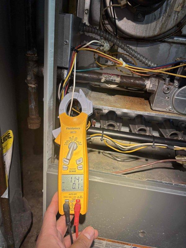 Completed comprehensive BFMA preventive maintenance tune-up on 10-year-old commercial furnace system. Performed electrical diagnostics with multimeter confirming proper voltage readings at 114V, inspected all internal components including wiring harnesses, gas valve assembly, and copper refrigerant lines for proper connections and wear. Evaluated heat exchanger and condensate trap for corrosion and oxidation, documented existing patina on metallic surfaces, verified all mechanical connections and fittings are secure, and confirmed system operational parameters meet manufacturer specifications for continued reliable performance.