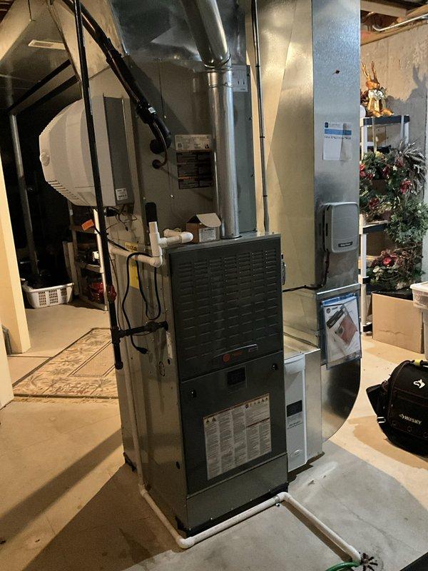 Responded to follow-up service call for air conditioning system diagnostic. Previous technician unable to complete diagnosis due to furnace-related concerns. Performed comprehensive inspection of residential HVAC system including furnace unit, ductwork connections, and associated A/C components. Evaluated furnace operation, verified proper airflow through metallic ductwork and plenum assembly, and inspected PVC condensate drainage system. Assessed electrical connections and overall system integration between heating and cooling equipment to identify any issues affecting A/C performance.