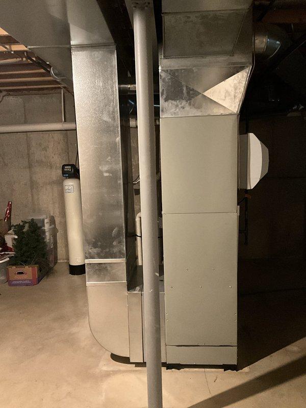 Responded to follow-up service call for air conditioning system diagnostic. Previous technician unable to complete diagnosis due to furnace-related concerns. Performed comprehensive inspection of residential HVAC system including furnace unit, ductwork connections, and associated A/C components. Evaluated furnace operation, verified proper airflow through metallic ductwork and plenum assembly, and inspected PVC condensate drainage system. Assessed electrical connections and overall system integration between heating and cooling equipment to identify any issues affecting A/C performance.