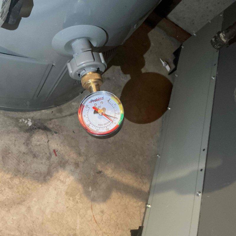 Completed comprehensive BFMA tune-up service including furnace maintenance, humidifier service with #35 pad replacement, and semi-annual filter change #213. Inspected heating system components, verified proper operation of all equipment, and confirmed system pressures within normal operating range as indicated by gauge readings. All maintenance items addressed per recurring service schedule with equipment showing one year of age.