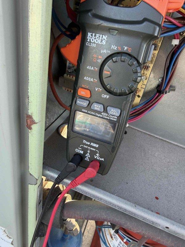 Completed comprehensive commercial tune-up service on four rooftop units, one boiler, and one hanging unit in lower level. Performed diagnostic testing using digital clamp meter to verify electrical parameters including voltage, amperage, and system performance across all equipment. Inspected and evaluated electrical connections, contactors, and terminal blocks; documented wiring conditions and component integrity with detailed photographs for service records.