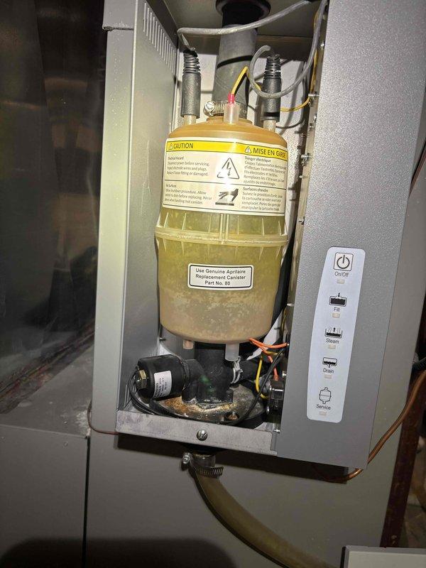 Completed comprehensive BFMA tune-up on 14-year-old furnace system including inspection of humidifier assembly with Aprilaire water panel and verification of electrical connections using digital multimeter. Performed standard maintenance procedures, tested system operation, and confirmed all components functioning within manufacturer specifications with electrical readings at appropriate levels.