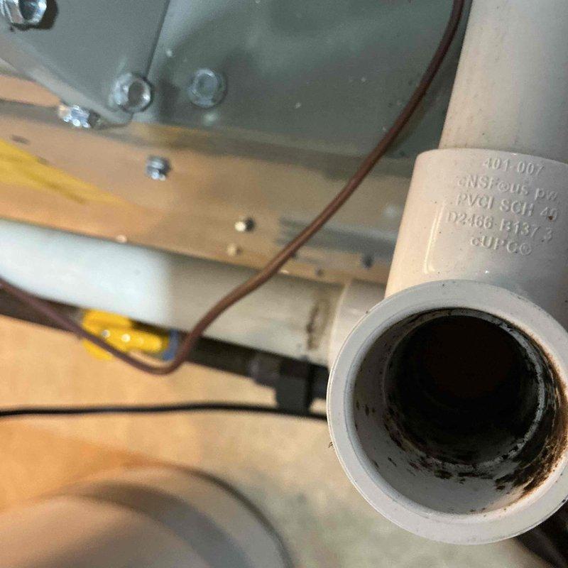 Completed comprehensive furnace tune-up on equipment over 5 years old during afternoon appointment. Performed standard maintenance procedures including combustion analysis with carbon monoxide testing, which registered 0 ppm indicating proper combustion and safe operation. Inspected condensate drain system and noted discoloration present in PVC drain line, indicating normal aging but functional drainage with no immediate concerns requiring correction at this time.