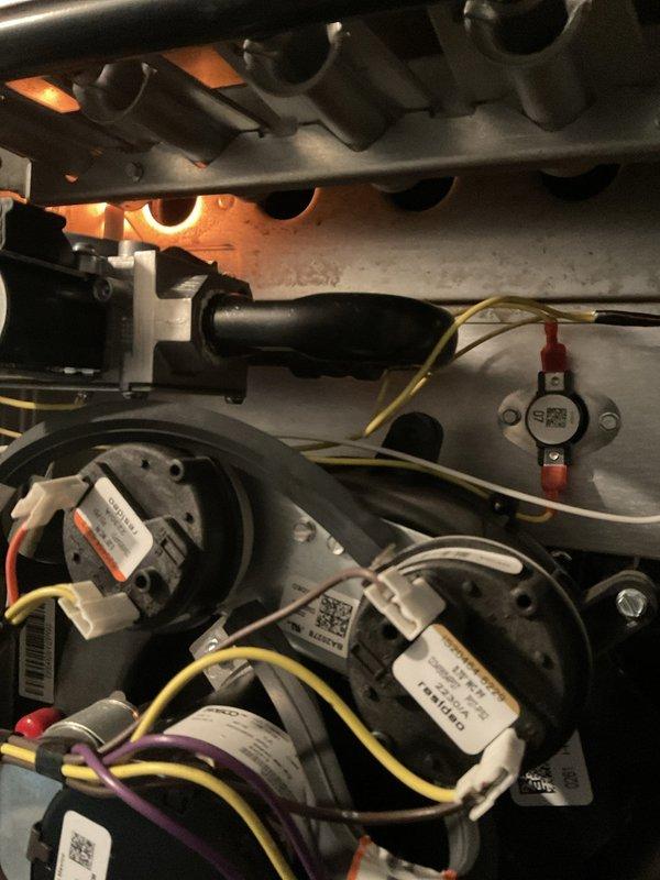 Completed comprehensive BFMA tune-up service on a 2+ year old furnace system during morning appointment window. Performed thorough inspection of heat exchanger, blower motor assemblies, electrical connections, and combustion components, confirming all systems operating within normal parameters with proper flame characteristics and airflow. Inspected humidifier system and associated plumbing connections in utility area, noting existing moisture staining on concrete surfaces but verifying all active components functioning correctly with no active leaks detected.