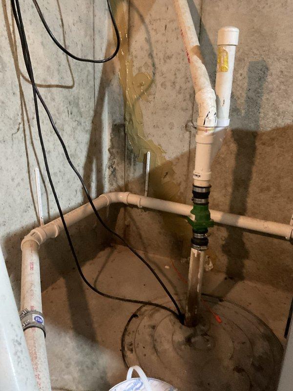 Completed comprehensive BFMA tune-up service on a 2+ year old furnace system during morning appointment window. Performed thorough inspection of heat exchanger, blower motor assemblies, electrical connections, and combustion components, confirming all systems operating within normal parameters with proper flame characteristics and airflow. Inspected humidifier system and associated plumbing connections in utility area, noting existing moisture staining on concrete surfaces but verifying all active components functioning correctly with no active leaks detected.