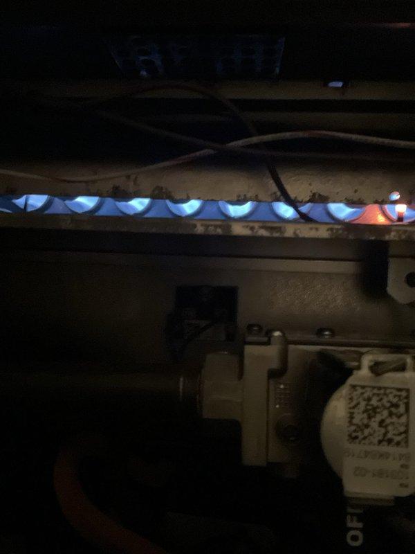 Completed comprehensive furnace tune-up on 11+ year old gas heating unit during afternoon service window. Performed full system inspection including burner assembly evaluation, gas valve operation verification, and heat exchanger condition assessment. Observed proper blue flame combustion pattern indicating correct air-to-fuel ratio and efficient operation. Inspected internal components, confirmed all safety controls functioning within manufacturer specifications, and documented system condition with photographic evidence for maintenance records.