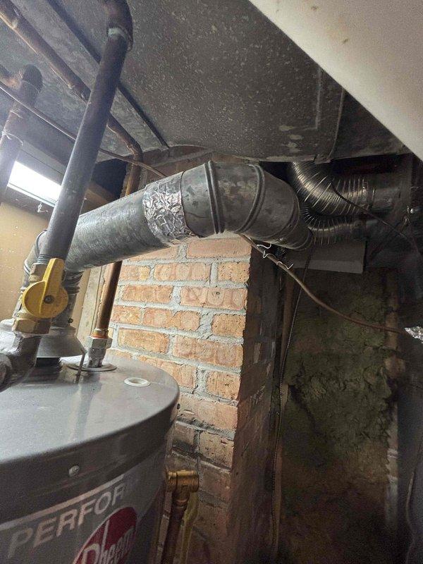 Completed comprehensive furnace tune-up in basement mechanical room as part of BFMA maintenance agreement. Performed full system inspection, checked all operational components, and replaced 16x25x1 air filter which showed moderate dust accumulation. Noted aging mechanical room environment with visible ceiling deterioration, moisture indicators on walls, and general wear consistent with older installation. All findings documented photographically and communicated directly to property owner per service instructions, with system left in proper working condition.