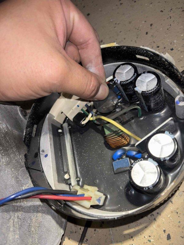 Replaced defective blower motor assembly in Trane furnace under manufacturer's warranty coverage. Disconnected existing motor wiring harness, removed failed motor from housing, installed new motor assembly, reconnected all electrical connections, and verified proper operation of heating system.
