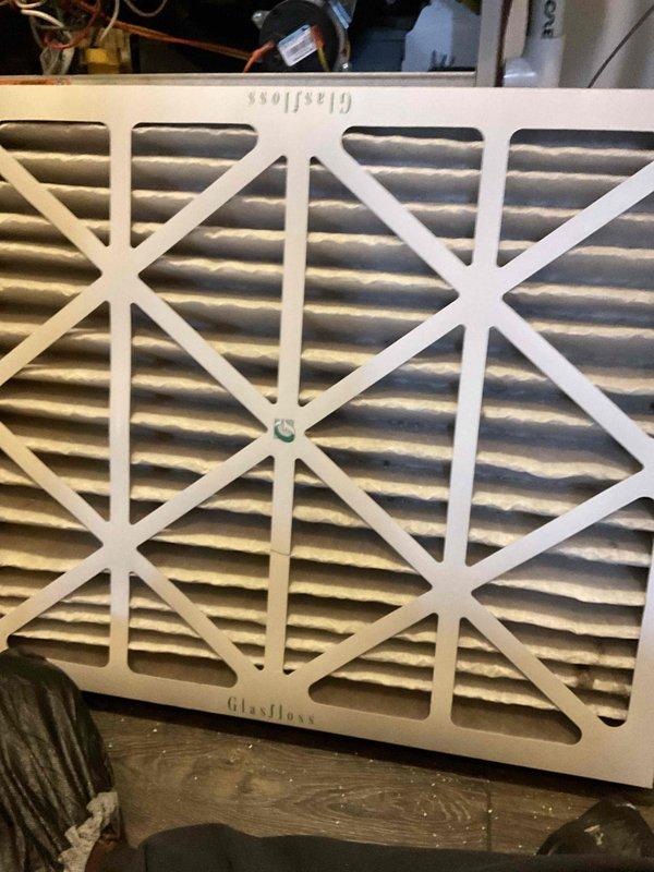 Completed comprehensive BFMA tune-up on 9+ year old Carrier furnace system in residential basement utility room. Performed standard maintenance protocol including system inspection, component testing, and replaced dirty Glasflast air filter that showed significant dust accumulation. All HVAC equipment operating within normal parameters upon completion of service.