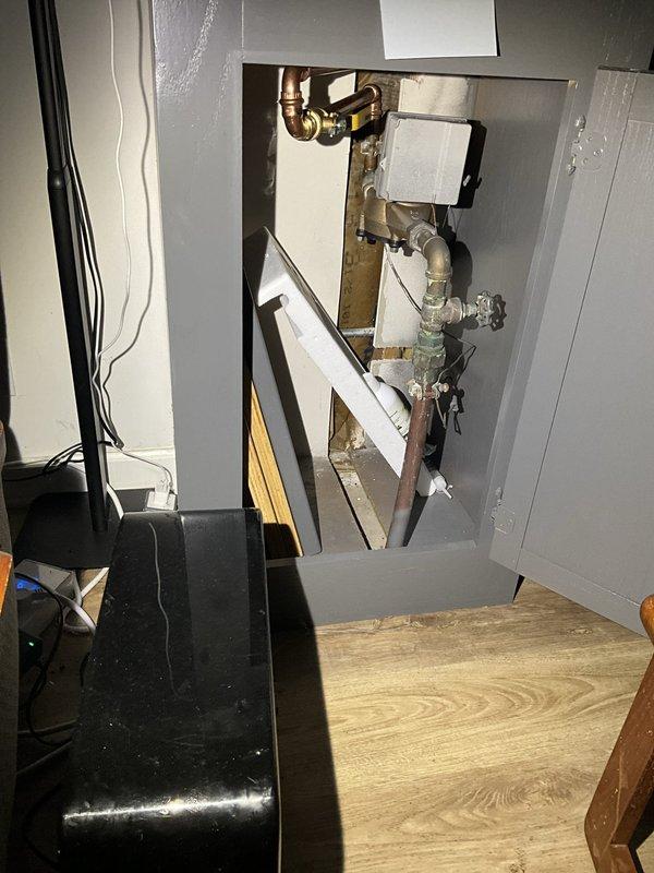 Performed comprehensive inspection and maintenance on Energy Star rated tankless water heater unit, verifying proper operation of all components including control panel functionality, gas connections, and venting system. Replaced main water shut-off valve for the residence, installing new valve with proper copper pipe connections and fittings to ensure reliable water supply control. Inspected and tested all plumbing connections at the tankless unit, including inlet and output lines with isolation valves, flexible gas line, and PVC condensate drainage assembly. Verified all shut-off valves operate smoothly and confirmed system pressures are within manufacturer specifications. Unit tested successfully with no leaks detected at any connection points.