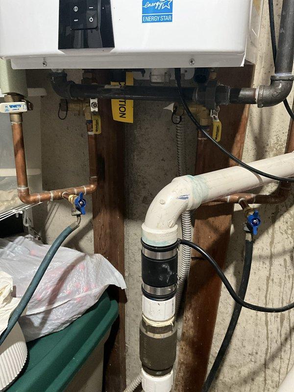 Performed comprehensive inspection and maintenance on Energy Star rated tankless water heater unit, verifying proper operation of all components including control panel functionality, gas connections, and venting system. Replaced main water shut-off valve for the residence, installing new valve with proper copper pipe connections and fittings to ensure reliable water supply control. Inspected and tested all plumbing connections at the tankless unit, including inlet and output lines with isolation valves, flexible gas line, and PVC condensate drainage assembly. Verified all shut-off valves operate smoothly and confirmed system pressures are within manufacturer specifications. Unit tested successfully with no leaks detected at any connection points.