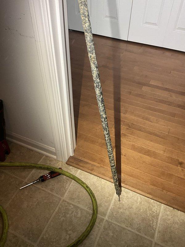 Responded to residential water heater service call for anode rod replacement. Upon arrival, accessed the water heater and removed the heavily corroded original anode rod, which showed significant mineral deposit buildup and deterioration throughout its length. The rod exhibited extensive calcification and corrosion, indicating it had reached the end of its service life and required replacement to prevent tank degradation. Successfully installed new anode rod with proper threading and torque specifications to ensure continued tank protection and extend the operational lifespan of the water heater unit.
