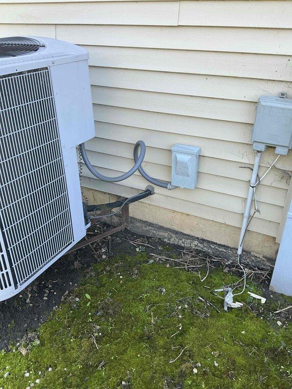 Conducted sales estimate for air conditioning system replacement with new evaporator coil at residential property. Existing outdoor condenser unit currently operational but drawing excessive amperage, indicating compressor strain and potential electrical issues. Customer recently replaced furnace and requires AC-only system replacement with basement air handler location. Assessed exterior installation site including condenser pad condition, electrical service access, and refrigerant line routing for complete system changeout proposal.