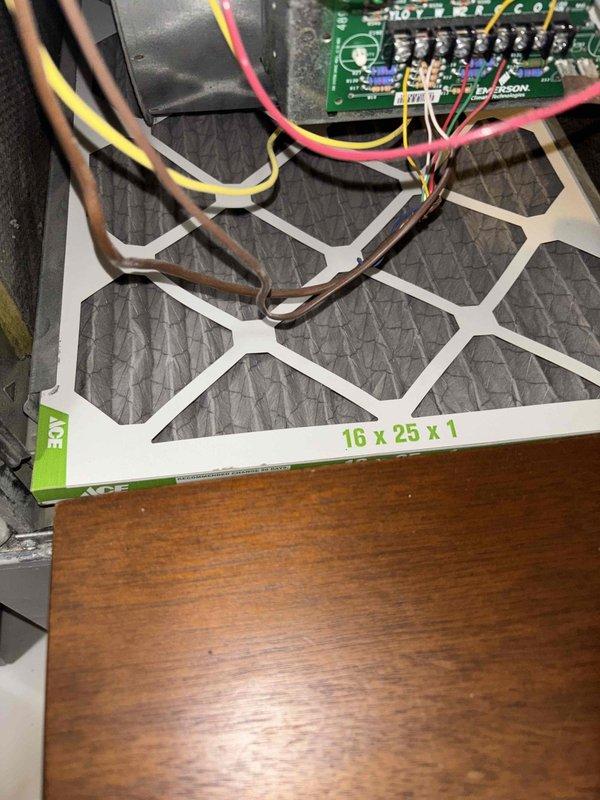 Responded to after hours service call for HVAC system inspection. Upon arrival, examined White-Rodgers control board wiring connections and verified proper termination of all low-voltage wires including thermostat connections. Inspected 16x25x1 air filter condition and confirmed proper fitment in filter rack. Documented humidistat and Braeburn digital thermostat settings, noting system displaying 69°F current temperature with 74°F setpoint. All components found operational with no immediate issues requiring repair.