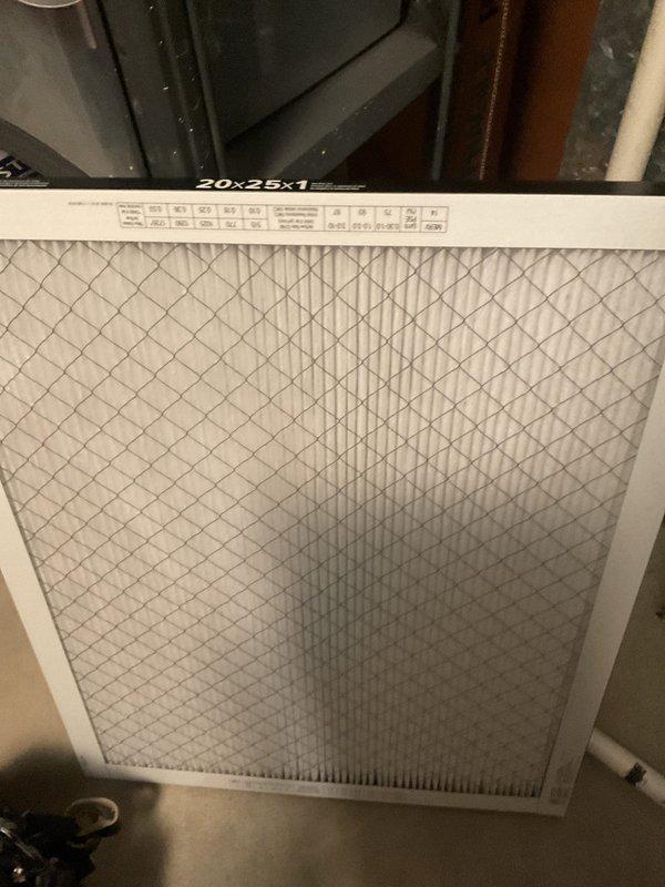 Completed comprehensive furnace tune-up and system inspection as part of BFMA maintenance agreement. Inspected and photographed 20x25x1 air filter showing clean condition with proper diagonal cross-hatch media pattern and verified correct installation in ductwork. Documented Bradford White water heater installation showing proper venting, copper piping connections, gas control valve assembly, and all safety labels intact and visible.