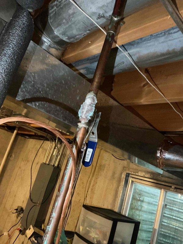 Completed comprehensive BFMA tune-up service on heating system including furnace and humidifier maintenance per recurring ESA agreement. Inspected evaporator coil assembly showing normal dust accumulation on fins, verified refrigerant line connections and copper tubing integrity throughout system. Performed standard maintenance procedures on 2-year-old equipment, checked attic-mounted ductwork and mechanical components, and confirmed all systems operating within manufacturer specifications.