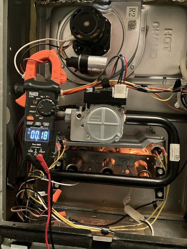 Completed comprehensive furnace tune-up and safety inspection as part of BFMA preventive maintenance agreement. Performed full system diagnostics including electrical measurements with digital multimeter, verifying proper amperage draw on blower motor assembly at 0.18 amps and system voltage reading of 45.22 volts. Inspected heat exchanger for cracks or deterioration, checked gas valve operation and connections, verified all electrical connections and wiring integrity, and confirmed proper blower motor function. All components found operating within manufacturer specifications with no safety concerns identified.