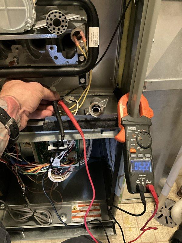 Completed comprehensive furnace tune-up and safety inspection as part of BFMA preventive maintenance agreement. Performed full system diagnostics including electrical measurements with digital multimeter, verifying proper amperage draw on blower motor assembly at 0.18 amps and system voltage reading of 45.22 volts. Inspected heat exchanger for cracks or deterioration, checked gas valve operation and connections, verified all electrical connections and wiring integrity, and confirmed proper blower motor function. All components found operating within manufacturer specifications with no safety concerns identified.