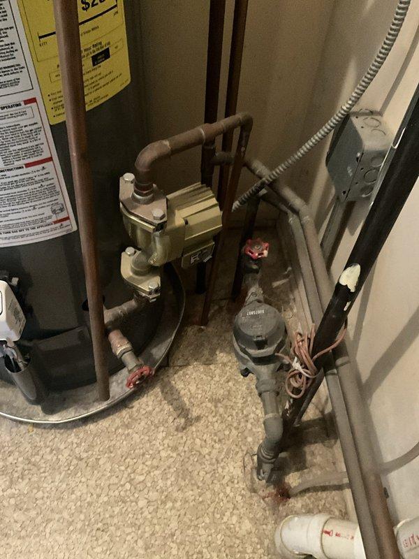 Responded to no hot water complaint at kitchen sink while all other fixtures had hot water. Upon inspection, identified issue was isolated to single fixture rather than water heater malfunction. Water heater and associated plumbing infrastructure found in proper working condition with circulator pump, shut-off valves, and connections functioning normally. Determined kitchen faucet cartridge or supply line issue requiring further investigation at fixture location.