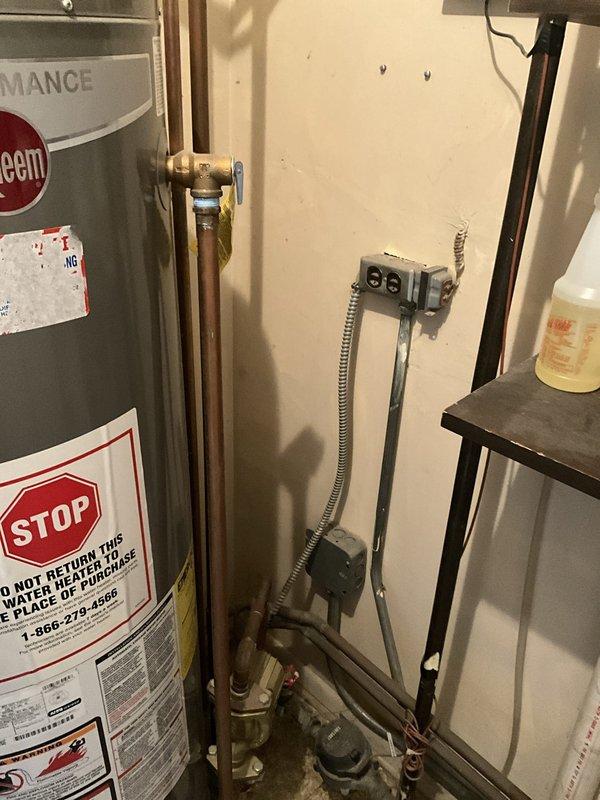 Responded to no hot water complaint at kitchen sink while all other fixtures had hot water. Upon inspection, identified issue was isolated to single fixture rather than water heater malfunction. Water heater and associated plumbing infrastructure found in proper working condition with circulator pump, shut-off valves, and connections functioning normally. Determined kitchen faucet cartridge or supply line issue requiring further investigation at fixture location.
