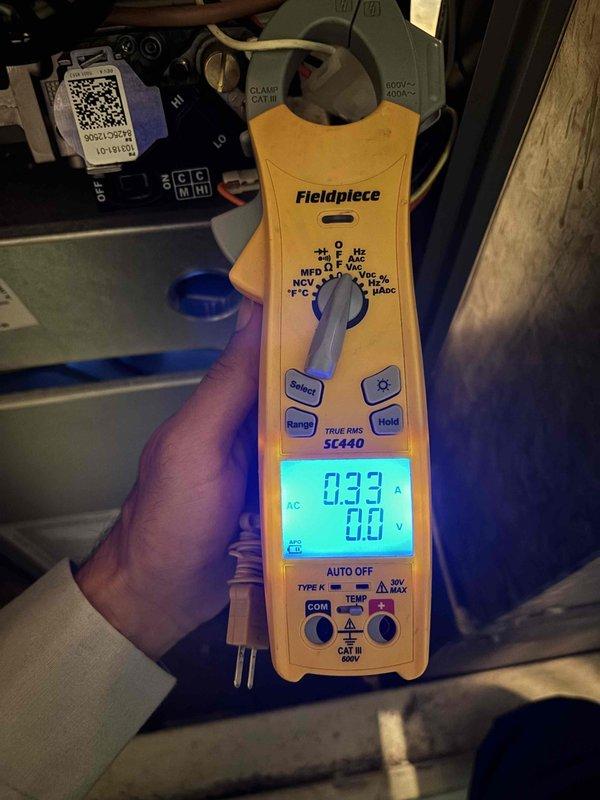 Completed comprehensive BFMA furnace tune-up on 11-month-old heating system during morning service window. Performed full system inspection including blower assembly examination, electrical current draw measurements using clamp meter showing 0.33 amps, and verified proper operation of all furnace components. System found to be operating within manufacturer specifications with minimal dust accumulation noted on blower wheel and ductwork.