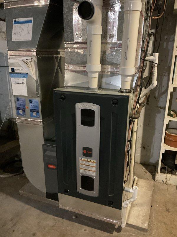 Completed comprehensive BFMA tune-up service on 9+ year old furnace system including humidifier and filter maintenance. Responded to no-heat call and diagnosed heating system failure. Performed complete system inspection, tested all safety controls, cleaned burner assembly, checked gas pressure and flame characteristics, verified proper ignition sequence, inspected heat exchanger for cracks or deterioration, and tested blower motor operation. Serviced humidifier unit including cleaning water panel and verifying proper water flow and drainage. Installed new air filter and cleared condensate drain lines. Inspected all electrical connections, tested thermostat operation, and verified proper venting through PVC exhaust system. Restored heating functionality and confirmed system operating safely within manufacturer specifications. All components now functioning properly with improved efficiency and reliability.